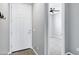 Bright entryway with light gray walls, a white door, and stylish decor at 35733 W Santa Monica Ave, Maricopa, AZ 85138