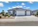 Charming single-story home with three-car garage and low-maintenance desert landscaping at 35733 W Santa Monica Ave, Maricopa, AZ 85138