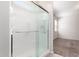 Shower with a sliding glass door adjacent to the bath and bedroom at 4992 E Rhodium Dr, San Tan Valley, AZ 85143