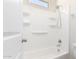 Bathroom featuring a tub and shower combo with storage shelves at 4992 E Rhodium Dr, San Tan Valley, AZ 85143