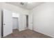 Neutral bedroom featuring an open closet and adjoining room access at 4992 E Rhodium Dr, San Tan Valley, AZ 85143