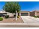 Attractive single-story home with desert landscaping and a two-car garage in a residential neighborhood at 4992 E Rhodium Dr, San Tan Valley, AZ 85143