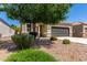 Attractive single-story home with desert landscaping and a two-car garage in a residential neighborhood at 4992 E Rhodium Dr, San Tan Valley, AZ 85143