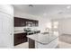 Modern kitchen boasts granite countertops, stainless steel appliances and a spacious center island with a sink at 4992 E Rhodium Dr, San Tan Valley, AZ 85143