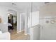 Bathroom with tiled floors and shower, glass partition, and view into bedroom at 15391 W Yucatan Dr, Surprise, AZ 85379