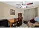 Office space with a ceiling fan, desk, and comfortable seating area at 15391 W Yucatan Dr, Surprise, AZ 85379