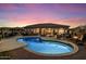Stunning backyard featuring a pool, patio, outdoor kitchen, and ample seating, ideal for entertaining guests at 22635 N 54Th Pl, Phoenix, AZ 85054