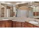 Primary bath with granite counters, dual sinks, and a large mirror, plus access to a walk in shower at 22635 N 54Th Pl, Phoenix, AZ 85054