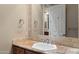 Clean bathroom featuring a single sink, granite countertops, and a large mirror at 22635 N 54Th Pl, Phoenix, AZ 85054