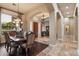 Open-concept view showcasing the dining room, foyer, and living spaces with archways and chandeliers at 22635 N 54Th Pl, Phoenix, AZ 85054