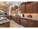 Stylish kitchen boasting custom cabinetry, stainless steel appliances, and granite countertops at 22635 N 54Th Pl, Phoenix, AZ 85054