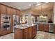 Spacious kitchen with a central island, stainless steel appliances, and granite countertops at 22635 N 54Th Pl, Phoenix, AZ 85054