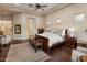 Spacious primary bedroom suite with tray ceiling, ensuite bathroom, and dark wood floors at 22635 N 54Th Pl, Phoenix, AZ 85054