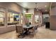 Covered patio featuring a dining table, fan, and built-in outdoor lighting at 22635 N 54Th Pl, Phoenix, AZ 85054