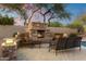Cozy outdoor fireplace with comfortable seating, perfect for relaxing evenings at 22635 N 54Th Pl, Phoenix, AZ 85054