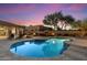 Beautiful backyard pool and patio area with outdoor seating and a fireplace, perfect for entertaining at 22635 N 54Th Pl, Phoenix, AZ 85054