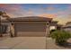 Charming single-story home with desert landscaping, tile roof, and a spacious two-car garage at 30374 N Sunray Dr, Queen Creek, AZ 85143
