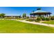 Community gazebo and picnic area with lush greenery and well-maintained paths, perfect for outdoor gatherings and relaxation at 30374 N Sunray Dr, Queen Creek, AZ 85143