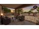 Inviting covered patio with stylish outdoor seating, perfect for enjoying the serene backyard views at 30374 N Sunray Dr, Queen Creek, AZ 85143