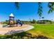 Neighborhood playground featuring a colorful play structure, open green space, and shady picnic areas for Gathering fun at 30374 N Sunray Dr, Queen Creek, AZ 85143