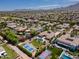 A sprawling neighborhood with sport courts, mature landscaping, swimming pools, and circular driveways at 3356 E Vallejo Ct, Gilbert, AZ 85298