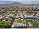Residential area with swimming pools, mature landscaping, mountain views, sport courts, and circular driveways at 3356 E Vallejo Ct, Gilbert, AZ 85298