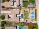 Expansive property featuring lush landscaping, pool, putting green, basketball courts, playground, and multiple outdoor entertainment areas at 3356 E Vallejo Ct, Gilbert, AZ 85298