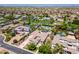 Estate home featuring mature landscaping, a circular driveway, private pool, sport court, and three car garage at 3356 E Vallejo Ct, Gilbert, AZ 85298