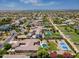 Beautiful residential area showcasing tennis courts, mature landscaping, swimming pools, and sport courts at 3356 E Vallejo Ct, Gilbert, AZ 85298