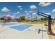 Home basketball and pickleball court surrounded by large yard at 3356 E Vallejo Ct, Gilbert, AZ 85298