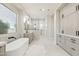 Bright bathroom features a soaking tub, double vanities, and natural light at 3356 E Vallejo Ct, Gilbert, AZ 85298