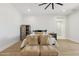 Inviting bedroom with seating, ceiling fan, and ample natural light at 3356 E Vallejo Ct, Gilbert, AZ 85298