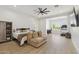 Expansive bedroom features natural light, wood floors, ceiling fan, and office space at 3356 E Vallejo Ct, Gilbert, AZ 85298