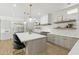 Modern kitchen featuring stone countertops, pendant lights, stainless steel appliances, and wood floors at 3356 E Vallejo Ct, Gilbert, AZ 85298