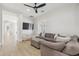 Comfortable living room featuring a sectional sofa, bean bag chairs, and large TV at 3356 E Vallejo Ct, Gilbert, AZ 85298