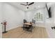 Bright office with wood-look flooring, a fan, and a window with shutter detail at 3356 E Vallejo Ct, Gilbert, AZ 85298