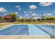 Pickleball court, basketball hoop, grass lawn and backyard of home at 3356 E Vallejo Ct, Gilbert, AZ 85298
