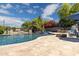 Inviting pool area with waterfall, patio, fire pit, and lounge seating at 3356 E Vallejo Ct, Gilbert, AZ 85298