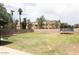 Spacious backyard with lush lawn, enclosed by a block fence and including a trampoline for Gathering enjoyment at 3722 E Glade Ave, Mesa, AZ 85206