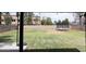 Large backyard featuring a well-maintained lawn, a trampoline, and a swing set, perfect for outdoor activities at 3722 E Glade Ave, Mesa, AZ 85206