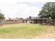 Expansive backyard with a well-kept lawn, bordered by a block fence, offering ample space for recreation at 3722 E Glade Ave, Mesa, AZ 85206