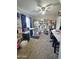 Spacious carpeted room, well lit, includes bookcases, a desk, and a treadmill at 3722 E Glade Ave, Mesa, AZ 85206