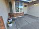 Inviting front porch with stylish brick accents and charming curb appeal at 3722 E Glade Ave, Mesa, AZ 85206