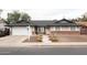 Charming single-story home featuring a manicured front yard with walkway and a combination brick and stucco exterior at 3722 E Glade Ave, Mesa, AZ 85206