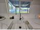 Close-up of modern sink with stainless steel grid and sleek fixtures at 3722 E Glade Ave, Mesa, AZ 85206