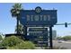 The Newton PHX directory sign listing local shops and eateries, surrounded by lush landscaping at 540 W Mariposa St # 9, Phoenix, AZ 85013