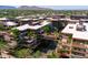 Exterior aerial view of an expansive residential complex boasts lush greenery and a scenic water feature at 7131 E Rancho Vista Dr # 1008, Scottsdale, AZ 85251