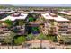 Exterior aerial view shows a community featuring lush landscaping and a central water feature at 7131 E Rancho Vista Dr # 1008, Scottsdale, AZ 85251