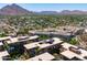 A high-angle view shows a vast community with mountain views in the background at 7131 E Rancho Vista Dr # 1008, Scottsdale, AZ 85251
