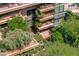 Close-up aerial view of private condo balconies with lush landscaping, seating areas and garden views at 7131 E Rancho Vista Dr # 1008, Scottsdale, AZ 85251